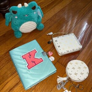 Claire's Letter K Bundle includes diary, wallet, bag charm and dragon wawa